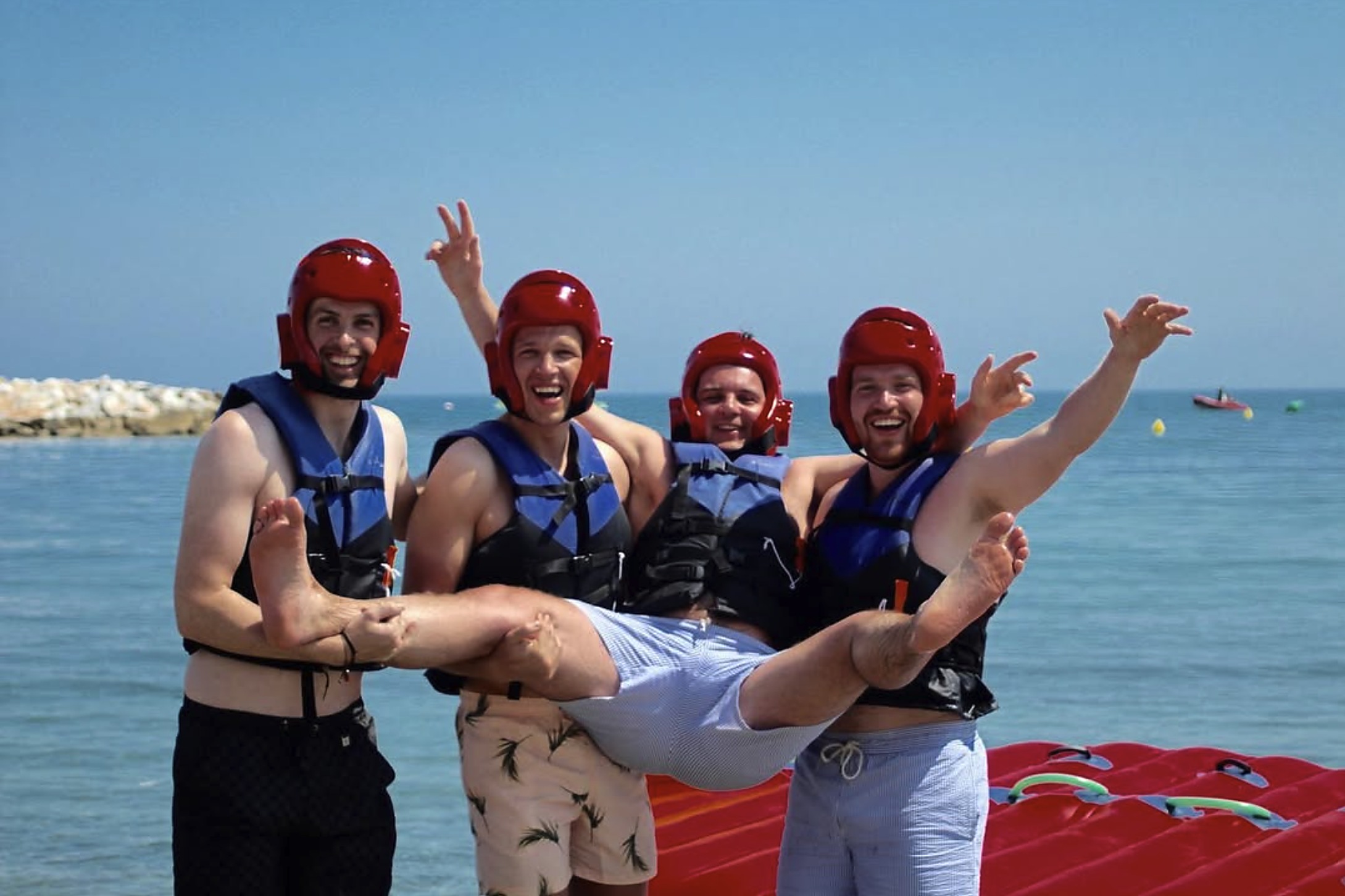 Friends celebrating after a pedal boat and inflatable ride at Puerto Banús