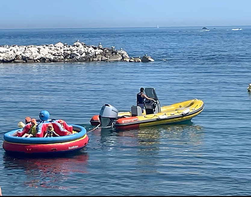 Hollywood Watersports tow boat pulling the sofa inflatable in Puerto Banús