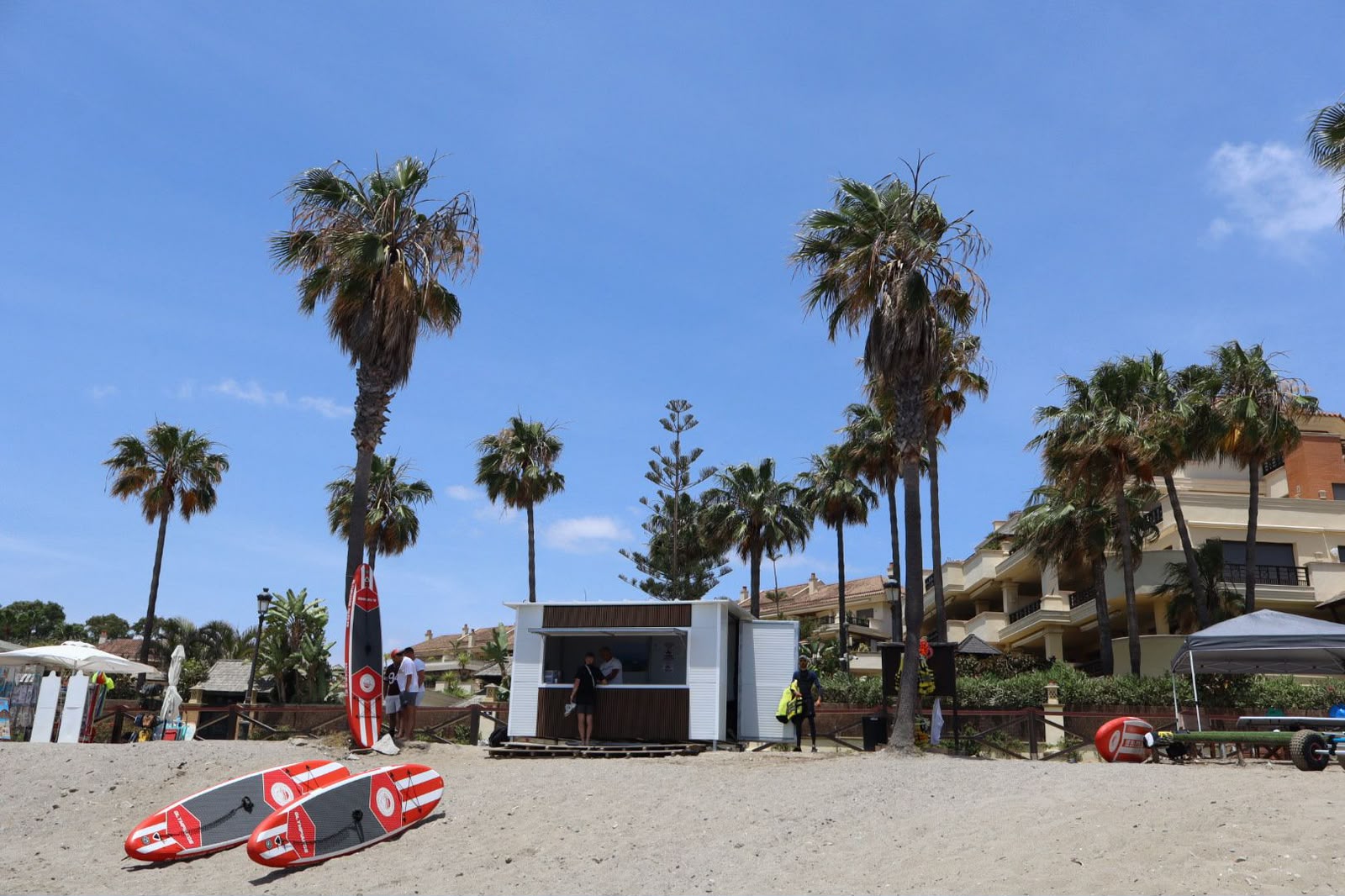 Hollywood Watersports beach kiosk with paddle boards at Playa el Rodeito