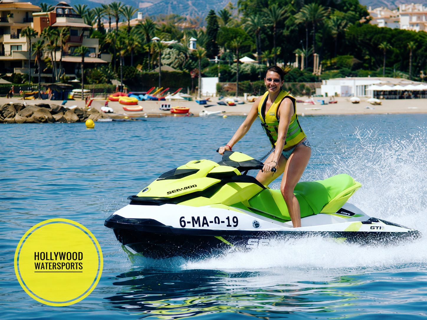 Rider on a green Sea-Doo jet ski along the Marbella coast