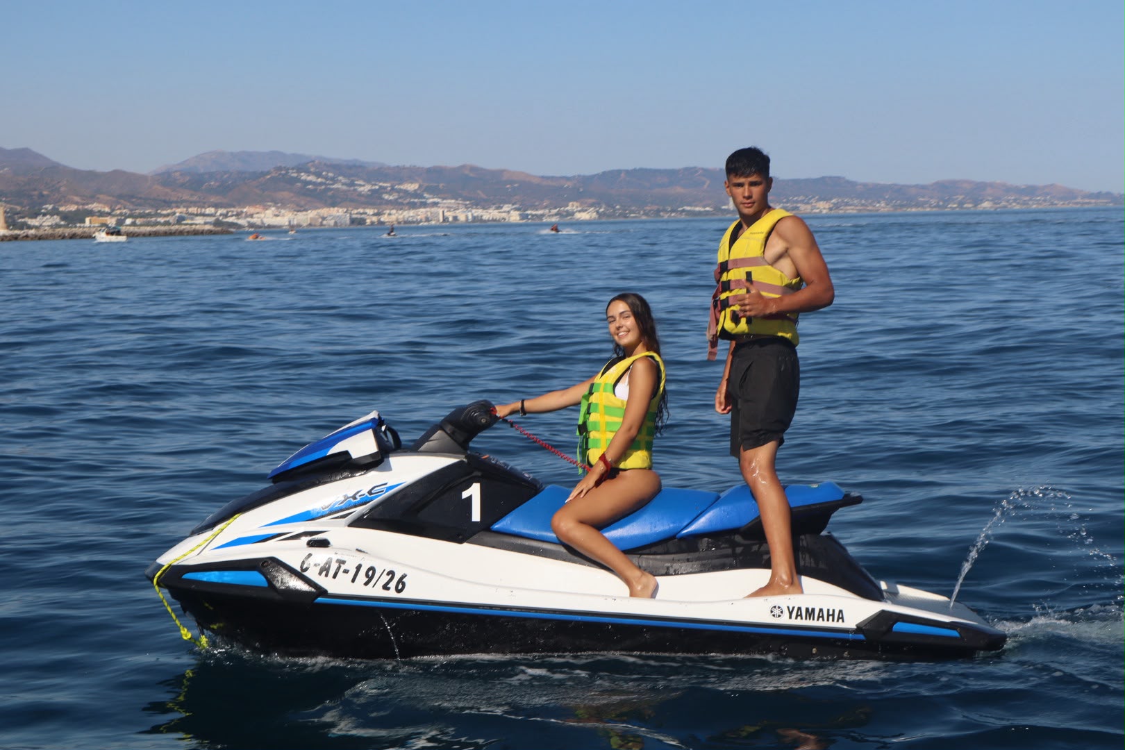 Couple on a blue Yamaha VX-S jet ski off the Marbella coast