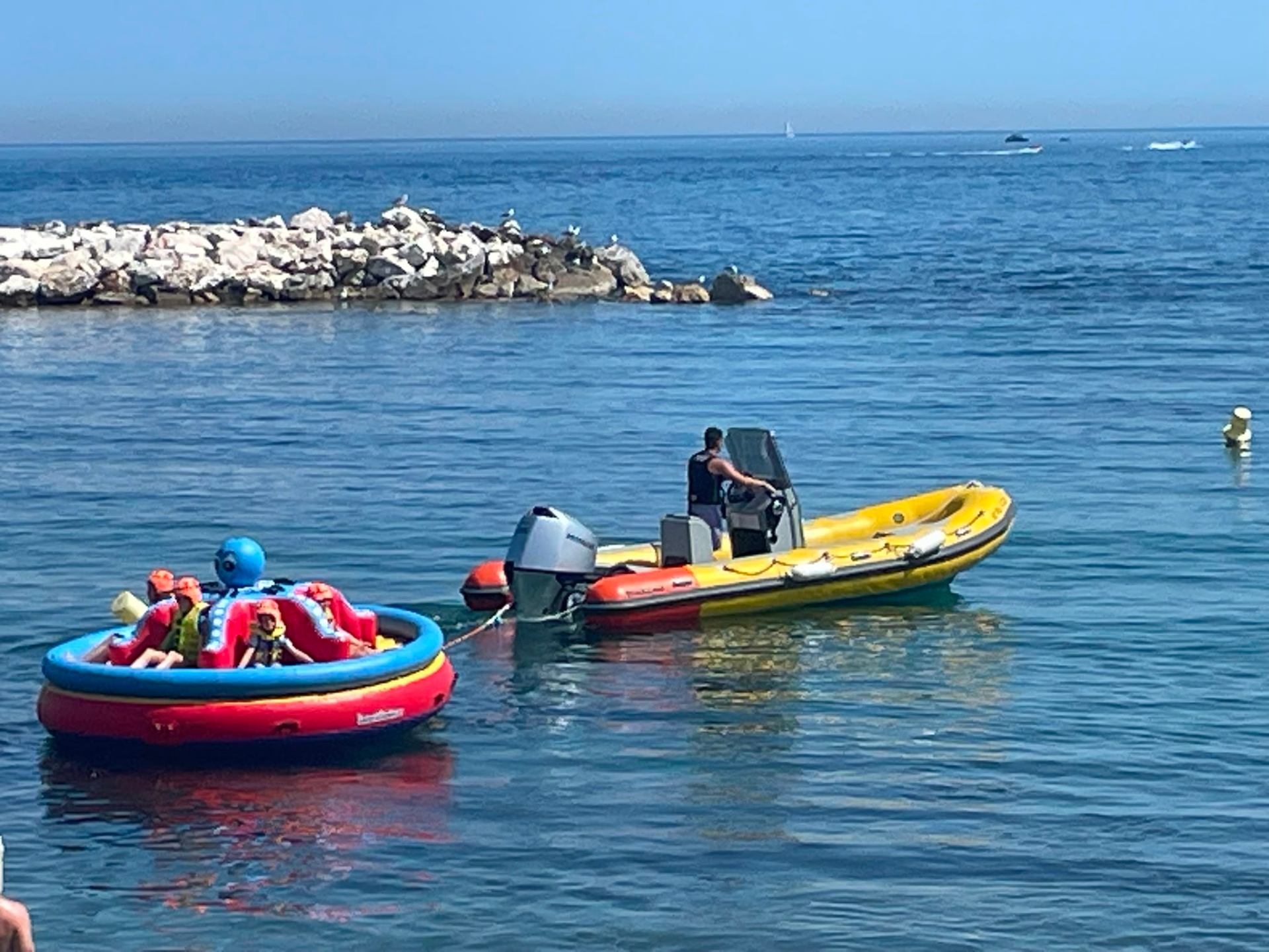 Hollywood Watersports boat towing the octopus inflatable in Puerto Banús